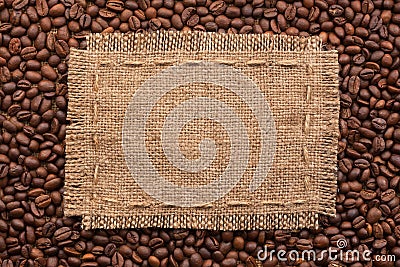 Frame of burlap and coffee beans lying on a white background Stock Photo