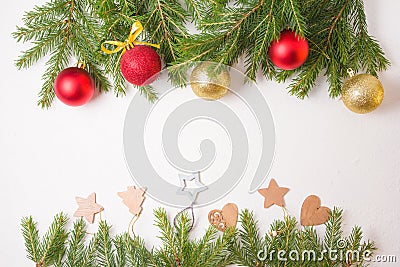 Frame from Christmas toys and natrual fir branches on a white background Stock Photo