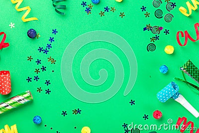 Frame from different celebratory items on green background Stock Photo