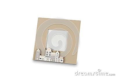 Photo frame with small houses on white background 3D illustration Stock Photo