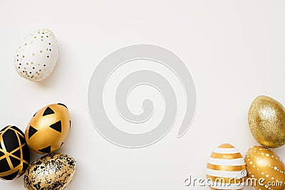 Frame of Easter golden decorated eggs isolated on white background. Minimal easter concept. Happy Easter card with copy space Stock Photo