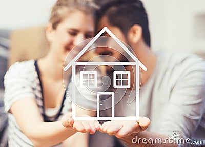 Frame made out of fruits and vegetables isolated on whiteYoung couple holding their new, dream home in hands Stock Photo