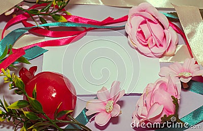 Frame made of ribbons and flowers on a white background with copy space Stock Photo