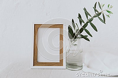 Frame mockup, olive branch in glass bottle, pitcher, styled minimalist clean image Stock Photo