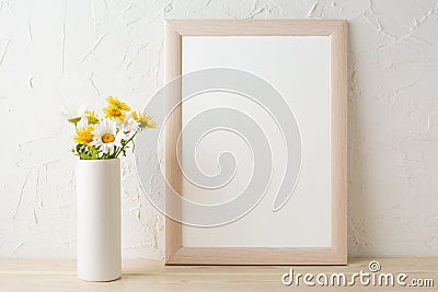 Frame mockup with white and yellow chamomiles in vase Stock Photo