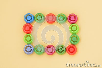 Multi-colored plastic corks from baby food, zero life-style waste, recycling garbage, environmental awareness Stock Photo