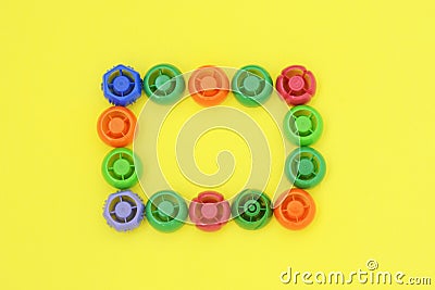 Multi-colored plastic corks from baby food, zero life-style waste, recycling garbage, environmental awareness Stock Photo