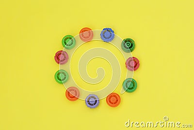 Multi-colored plastic corks from baby food, zero life-style waste, recycling garbage, environmental awareness Stock Photo