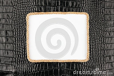 Frame of rope, lies on a background of a black natural leather Stock Photo