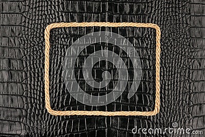 Frame of rope, lies on a background of a black natural leather Stock Photo