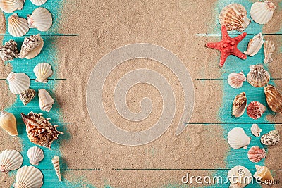 Frame of seashellson on sand wooden background. Space for text Stock Photo
