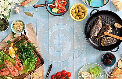 Frame of shrimp, fish grilled, salad and different snacks Stock Photo