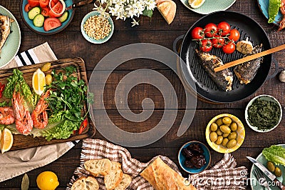 Frame of shrimp, fish grilled, salad and snacks Stock Photo