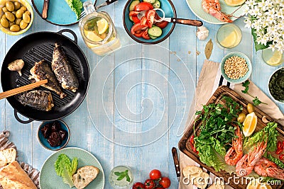 Frame of shrimp, fish grilled, salad, snacks and homemade lemonade Stock Photo