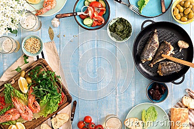 Frame of shrimp, fish grilled, salad, snacks and lager beer Stock Photo