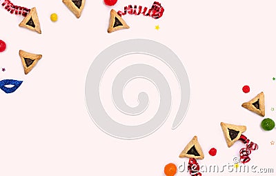 Frame of triangular cookies hamantasch or aman ears , candy, mask, serpentine, confetti for jewish holiday of purim celebration Stock Photo