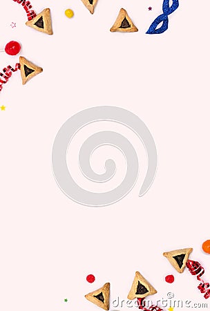 Frame of triangular cookies hamantasch or aman ears , candy, mask, serpentine, confetti for jewish holiday of purim celebration Stock Photo