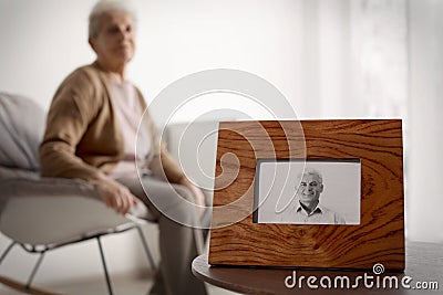 Framed photo of man and blurred female pensioner on background Stock Photo