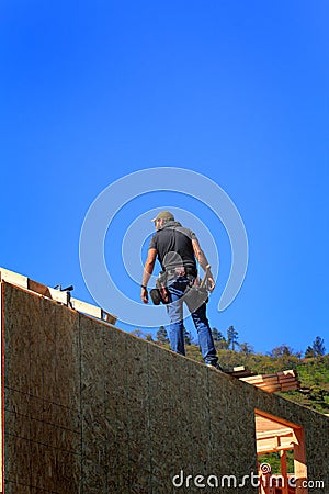 Framer on Top of Wall Stock Photo