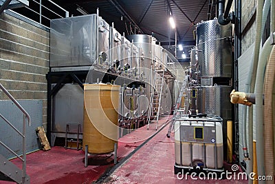 France Beaune 2019-06-20 Modern wine cellar, factory with large metallic clean shine stainless steel tanks for the fermentation. Editorial Stock Photo