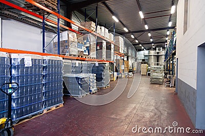 France Beaune 2019-06-20 Wine factory, production room, warehouse, shelving, shelves with boxes, empty wine bottles in package. Editorial Stock Photo