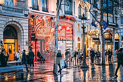 FRANCE - DECEMBER 14: People walking at the Champs Elysees at night, DECEMBER 14, 2017 in Paris, France Editorial Stock Photo