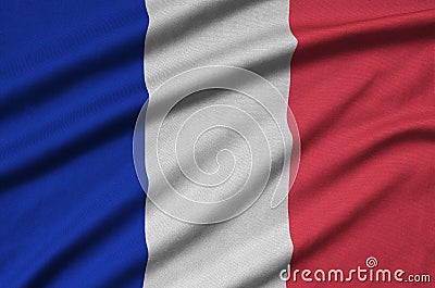 France flag is depicted on a sports cloth fabric with many folds. Sport team banner Stock Photo