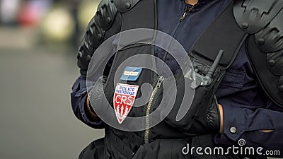 France policeman monitoring public order, protecting security in city streets Editorial Stock Photo