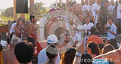 France, St. Tropez, 15 August 2017: The richest people arrange a shower of champagne, people hide from the rain of stock footage France, St. Tropez, 15 August 2017: The richest people arrange a shower of champagne, people hide from the rain of stock footage