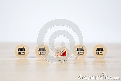 Wooden toy with graph and franchises business store icon for growth and product services or branch Stock Photo