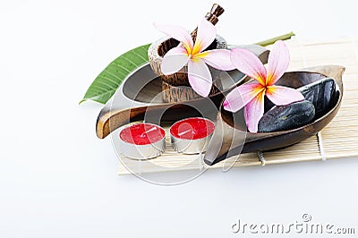 Frangipani flower with candle. Spa & aromatherapy concept. Stock Photo