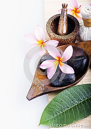 Frangipani flower with candle. Spa & aromatherapy concept. Stock Photo