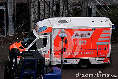 Frankfurt, Germany - January 2022: modern Red paramedic ambulance emergency service vehicle, medics provide assistance at Editorial Stock Photo