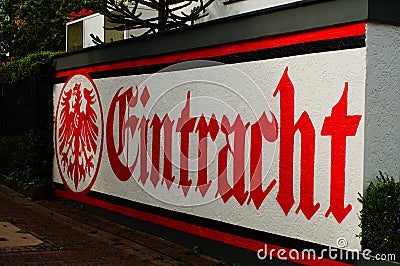 Logo and colours of the football club Eintracht Frankfurt on a garage. Editorial Stock Photo