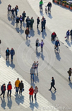people walking at the street with long shadows Editorial Stock Photo