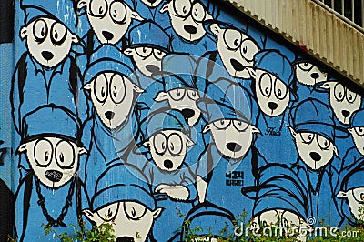 Graffito of a flock of sheep in blue clothing. Editorial Stock Photo