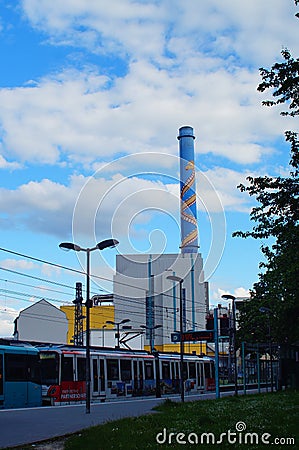 A metro station with a waste-to-energy plant in the background. Editorial Stock Photo