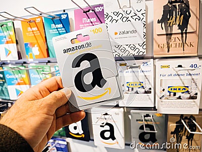 Man hand point of view customer shopping prepaid card Amazon Car Editorial Stock Photo