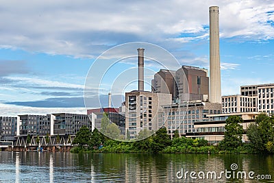 Frankfurt am Main industrial estate. Buildings on the river. High chimneys. Stock Photo