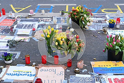 Frankfurt - March 2022: memorial day for the dead, flowers lie on ground, mourning candles burning for dead, an anti-war rally Editorial Stock Photo