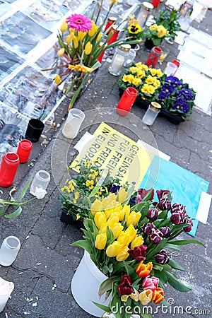 Frankfurt - March 2022: memorial day for the dead, flowers lie on ground, mourning candles burning for dead, an anti-war rally Editorial Stock Photo