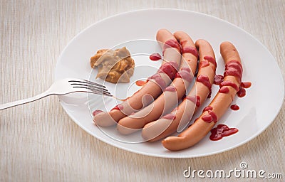 Frankfurters topped with ketchup and mustard Stock Photo