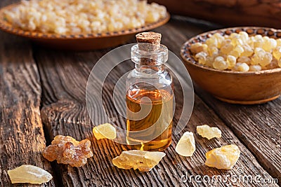 A bottle of frankincense essential oil with frankincense resin o Stock Photo