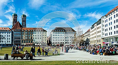 Frauenkirche cathedral towers over Marienhof park in Munich, Ger Editorial Stock Photo