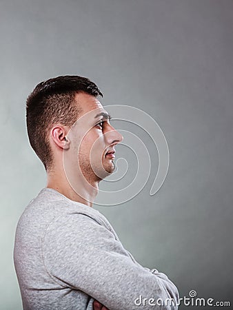 Fraught uptight bored man waiting crossing arms. Stock Photo