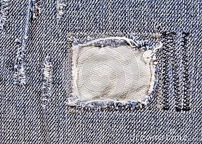 Frayed blue jeans closeup Stock Photo