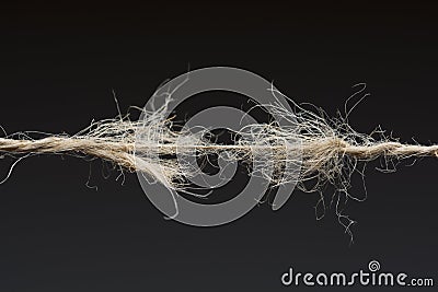 Frayed rope ready to break Stock Photo