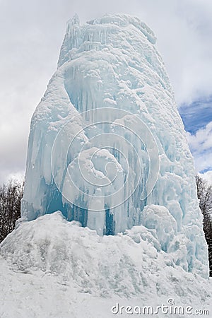 Freaks of nature. Huge icicle formed around a source of artesian Stock Photo