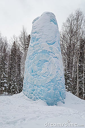 Freaks of nature. Huge icicle formed around a source of artesian Stock Photo