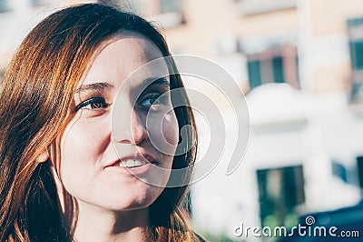 Freckled brunette young woman smiling Stock Photo